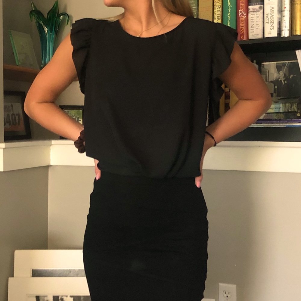 Beautiful open back light shirt, dress up or down.